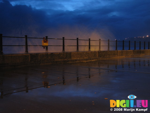 SX01820 Waves off Tramore promenade at dusk